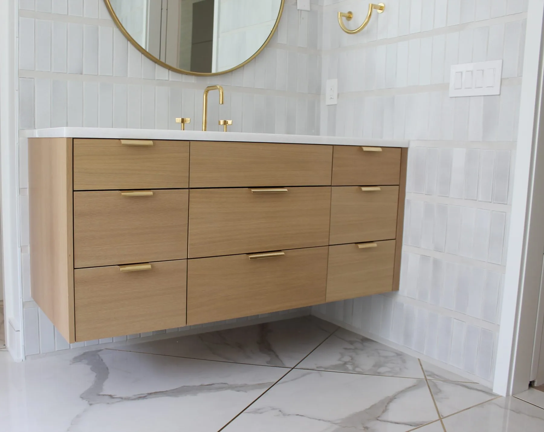 Custom floating bathroom vanity by Distinctive Cabinets