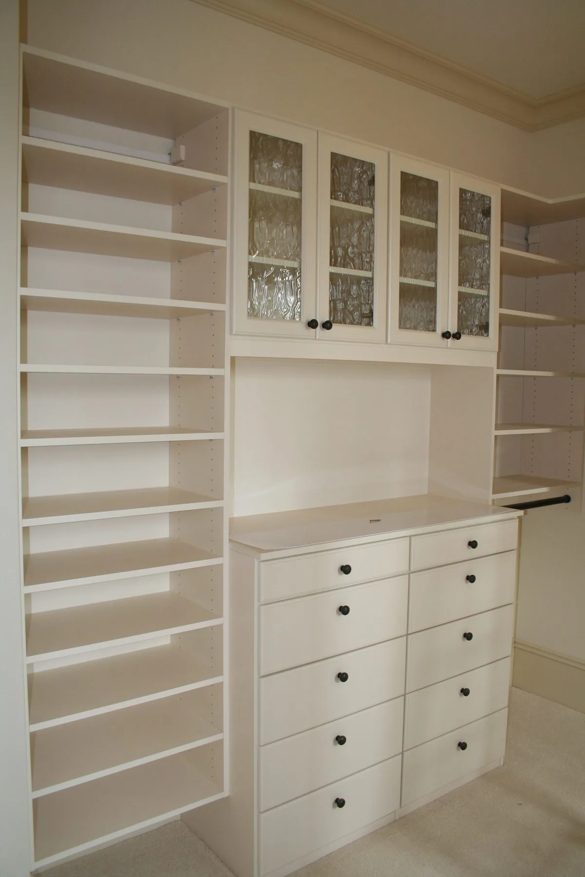 Custom closet shelving and cabinets by Distinctive Cabinets