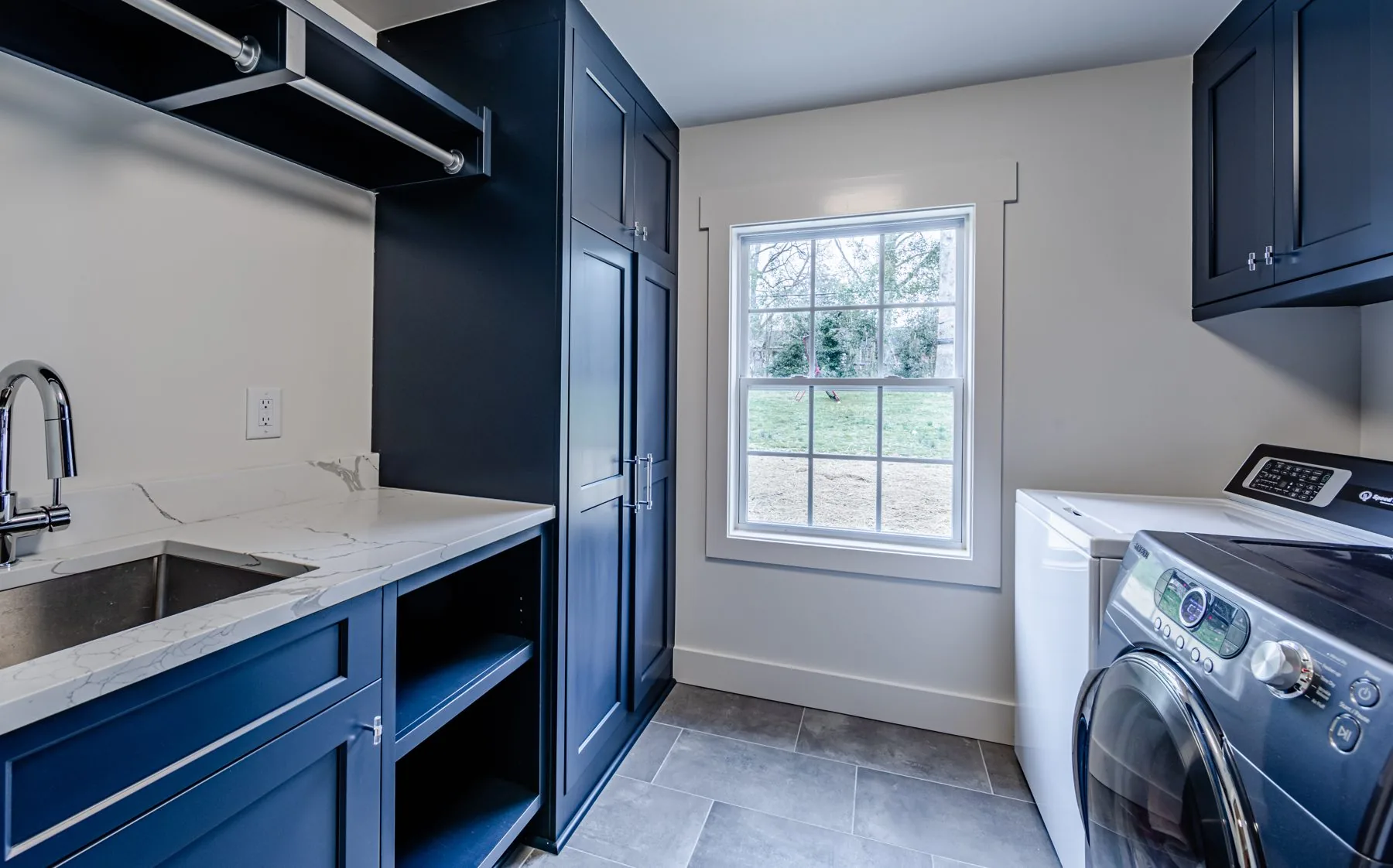 Custom laundry room cabinetry by Distinctive Cabinets